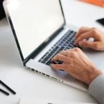 desk-fingers-work-notebook